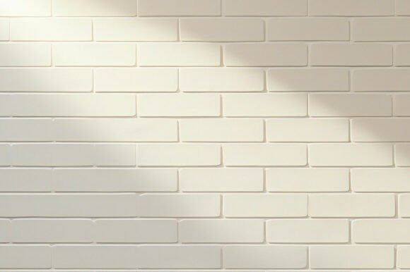 A White Brick Wall with Shadows on It
